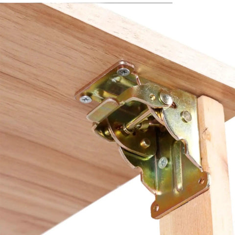 Tough As Nails Table Leg Folding Brackets 4 Pack Heavy Duty Self Locking Hinges with metal hinge mounted on wood.