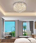Lit Crystal Raindrop Chandelier Flush Mount Ceiling Light With G9 Base Modern K9 Crystal Beads Chrome Finish in bedroom setting
