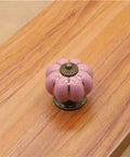 10 Pack Vintage Ceramic Pumpkin Cabinet Knobs In Sweet Pink Featuring A High Gloss Shine And Easy Peasy Install on wooden surface.