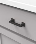 Studio Collection Cabinet Pull Three Inch Center To Center Oil Rubbed Bronze Highlighted Finish installed on drawer