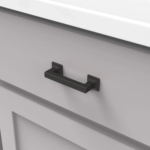 Studio Collection Cabinet Pull Three Inch Center To Center Oil Rubbed Bronze Highlighted Finish installed on drawer