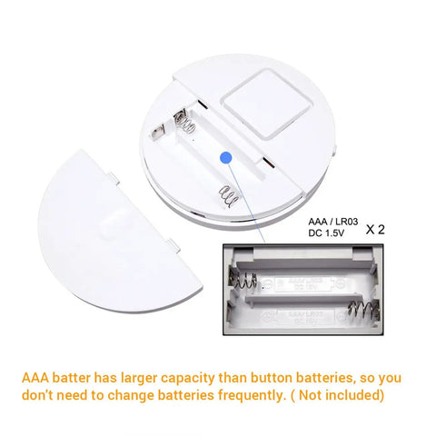 Ultra Thin Window Alarm With 120dB Loud Alarm And Vibration Sensor battery compartment, fits AAA batteries, white design.