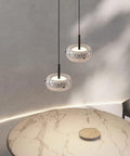 Resin Pendant Light, Gold 3 Color LED Hanging Fixture for Living Room illuminating a marble table with two stylish fixtures.