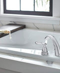 Elmhurst Roman Tub Trim Kit Chrome For 3 Hole 8 To 16 Inch Installations, ADA Compliant faucet on white bathtub
