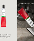 Red threadlocker being applied to metal assembly