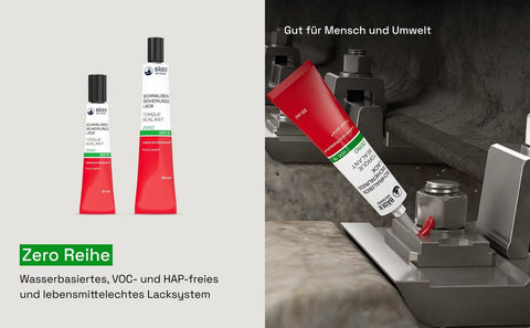 Red threadlocker being applied to metal assembly