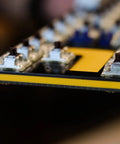 Close-up of Kickass Sixty Percent Compact Mechanical Keyboard With Hot Swappable Top Tier Keys and PBT Keycaps.