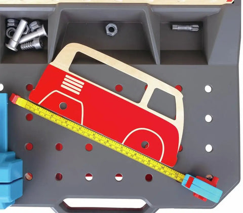 Vehicle Service And Repair Workbench Play Set With Realistic Tools For Young Builders Includes Drill Hammer Saw Wrench Tape Measure Bench Vice Gears Car Bodies Nuts And Bolts And Cardboard Garage Scene with car stencil and measuring tape on bench