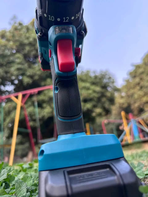 Badass 21V Rechargeable Cordless Drill Kit with 10mm Keyless Chuck and Dual Speed Settings Featuring Two Long Lasting Lithium Batteries Plus 24 Versatile Bits for Killer Home Reno and DIY Projects view from below highlighting the trigger and settings.