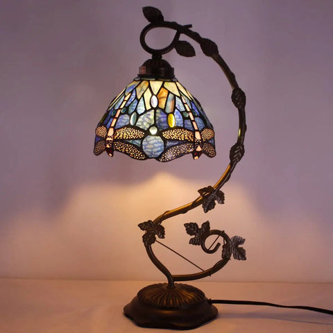 Blue Stained Glass Dragonfly Tiffany Style Table Lamp With Metal Leaf Accent, bronze resin base, lit shade, cozy desk or nightstand piece