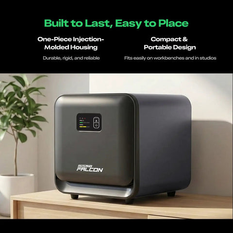 Falcon AP1 Mini Smoke Purifier For Laser Engravers on wooden surface, showing compact design and digital display panel.