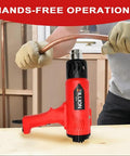 Person using 1800W Dual Temperature Heat Gun With 122F To 1202F Range, 4 Nozzles Kit, Black Red Pro Hot Air Gun for bending pipe