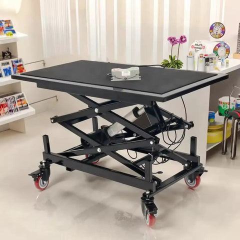 Heavy Duty Electric Scissor Lift Table With Smooth Hydraulic Action For Lifting Heavy Loads In Warehouses Or Factories Featuring Silent Motor And Adjustable Height Platform For Easy Material Handling Tasks in black steel, height adjustable from 37-120cm.
