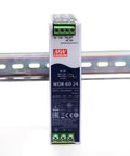 Heavy-Duty 60W 24V 2.5A Industrial Switching Power Supply With Ultra-Wide Input 180-550VAC And 254-780VDC DIN Rail Mount 4.7kV Isolation Built For Automation, Communications, And Manufacturing Equipment mounted on DIN rail