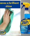 Hand cleaning window with cloth and Streak Free Glass Cleaner 32 Oz Pro Grade Formula For Windows And Surfaces Removes Fingerprints And Grime Fast Drying Multipurpose Ammonia Based Blue 1 Quart Bottle
