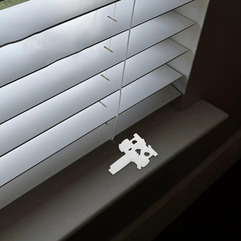 Dead Simple And Tough Vertical Blind Replacement Parts With Slick Pull Pulleys Plus Quick Fix Carrier Kits For Window Curtain Wands and Sturdy Plastic Home Office Repair Gear, white repair stem on window sill.
