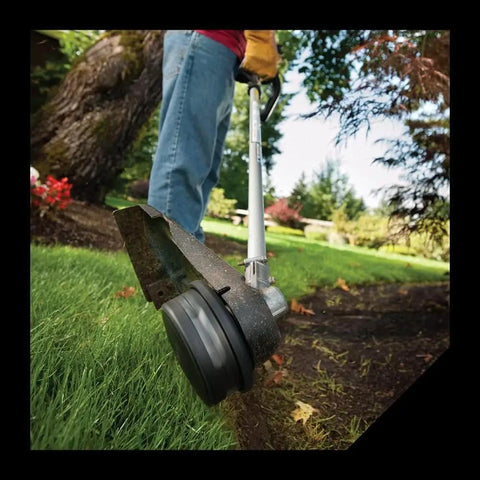 Gas trimmer with Beefy Square Trimmer Line For Gas And Electric Grass Trimmer, 0.155 Inch, 246 Foot Reel cutting grass