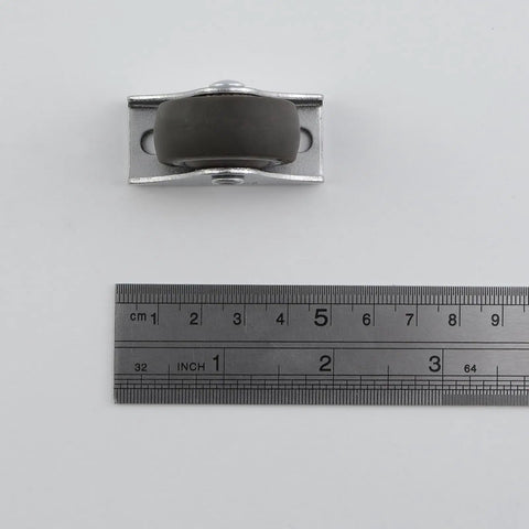 Slick Roll Mini Fixed Caster Wheels 1.26 Inch Ultra Thin Low Profile, TPE rubber with metal mount, viewed from above with ruler.