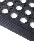 Close-up view of Anti Fatigue Drainage Rubber Matting For Indoor And Outdoor Use Built Tough, showing hole pattern and rubber texture.
