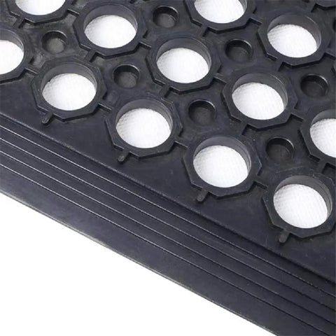 Close-up view of Anti Fatigue Drainage Rubber Matting For Indoor And Outdoor Use Built Tough, showing hole pattern and rubber texture.