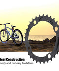 32T 104mm BCD Steel Round Chainring For 9 Speed Mountain Bikes Beefy Steel Build With Quiet Ride And Top Notch Chain Retention Durable MTB Replacement Part showcased near a mountain bike on rocky terrain at sunset