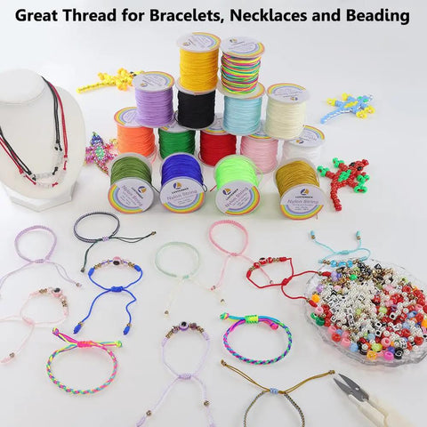 Colorful spools of 0.8mm nylon string for jewelry making with beaded bracelets and necklaces on display.