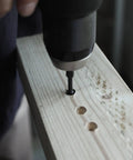 Drilling into wood with the Badass 15 Piece Countersink Drill Bit Set For Woodworking DIY Crews Featuring Tapered Plug Cutters Depth Stop Rings And Screwdriver Bits To Ace Any Job With Zero Headaches And Sweet Results.