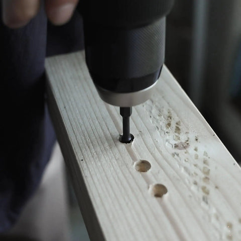 Drilling into wood with the Badass 15 Piece Countersink Drill Bit Set For Woodworking DIY Crews Featuring Tapered Plug Cutters Depth Stop Rings And Screwdriver Bits To Ace Any Job With Zero Headaches And Sweet Results.