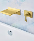 High Flow Wall Mount Tub Filler With Single Lever Large Waterfall Spout CUPC Certified Pressure Balance Rough In Valve Included Brushed Gold Finish Modern Bath Upgrade For Spa Vibes And A Handy Shelf For iPad Candles Or Glassware featuring a brushed gold finish with a modern minimalist design against a colorful wall backdrop.