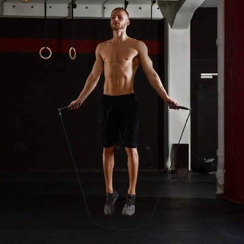 Man using Speed Jump Rope For Training And Fitness, Adjustable Length Tangle Free Rope With Dual Bearings, Durable Skipping Rope