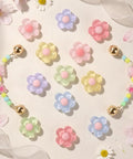 Pastel Jelly Daisy Flower Shoe Charms Set With Glossy Bling Floral Buckles, 12 colorful resin clips for sneakers, vibrant display.