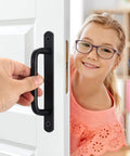 Person holding Two Pack Barn Door Handles Set Sliding Door Pulls Stainless Steel With Black Finish And Plates on a white door.