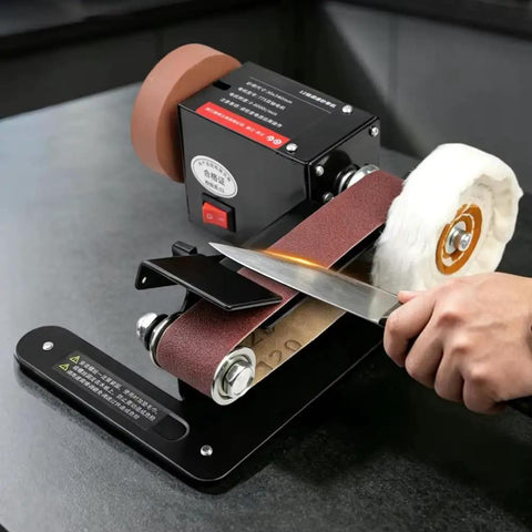 Badass Little Desktop Electric Belt Sander Kit With Variable Speed Control sharpening a knife on a compact unit.