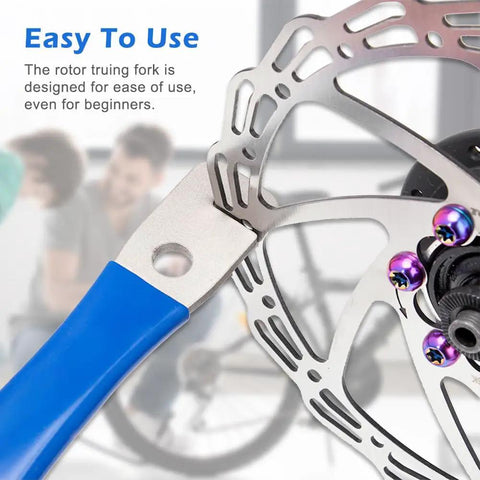 Close-up of Rotor Truing Fork Tool For Bike Disc Alignment And Rotor Straightening No Fuss Blue Bicycle Disc Rotor Alignment Tool.