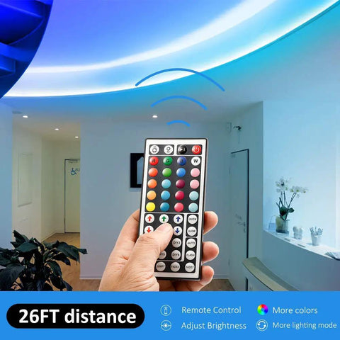Hand holding 44 Key RGB LED Light Strip Controller With Infrared Remote For SMD 5050 2835 3528 Strips, adjusting ceiling lights.
