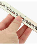Close-up of a hand holding a Rotating Concealed Door Hinges Set Of 5 Heavy Duty Cabinet Butt Hinges for folding doors.