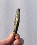 Side view of Dragon Pattern Alloy Tsuba Hand Guard For Katana Wakizashi And Tanto Dope Yellow Finish Fits Traditional Koshirae Swords.