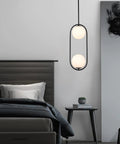 Modern Style Pendant Lighting With White Globe Glass Shade For Kitchen Island, Dining Room, And Bedroom, hanging in a bedroom setting.