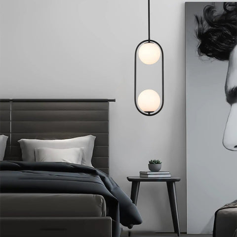 Modern Style Pendant Lighting With White Globe Glass Shade For Kitchen Island, Dining Room, And Bedroom, hanging in a bedroom setting.