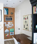 Premium Natural Cork Roll Four Feet By Twenty Four Feet Long Half Inch Thick used as a bulletin board in an office space.