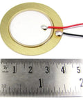 Close-up of 41mm piezo disc transducer with 3.94 inch wires next to a ruler, part of a 10 Pack 41mm Piezo Disc Transducers With 3.94 Inch Wires For Acoustic Instruments Contact Mic Drum Trigger Sound Sensor DIY Guitar Pickup Easy Install For Home Studio And Electronics Projects.