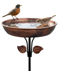 Two birds drinking from a Sturdy Metal Bird Bath Garden Stake With 12 Inch Bowl Outdoors 0.7 Gallon Capacity Yard Decor For Birds No Fuss Setup And Durable Weatherproof Design Included, metal design with leaf accents.