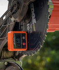 Klein Tools 935DAG digital angle gauge, orange, mounted on a circular saw blade.