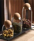 Lock In Freshness Straight Up With This Round Glass Tea Canister Boasting A Tight Cork Seal And Heat Resistant Build Ideal For Storing Coffee Beans Sugar Salt Or Loose Leaves While Looking Sharp On Counters.
