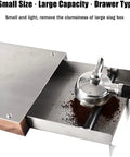 Close-up of Big League Stainless Steel Espresso Knock Box with detachable drawer, showing coffee grounds and portafilter.