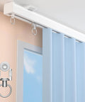 Heavy Duty Ceiling Curtain Track System With Whisper Quiet Glide For Room Dividers Aluminum Alloy Rails Ceiling Or Wall Mount White 3.3ft Track With Hooks For Sliding Curtains shown in close-up view installed with blue curtains.