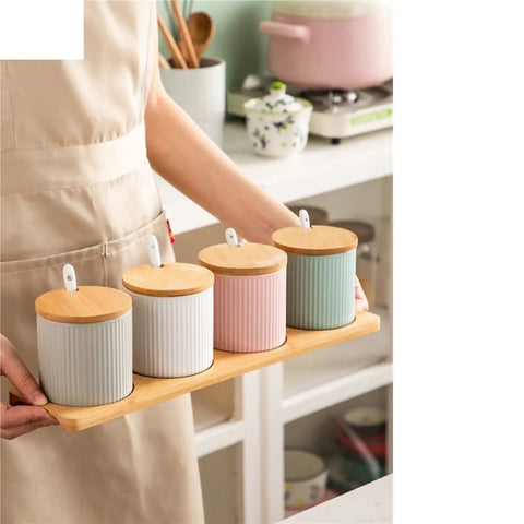 Top Shelf Ceramic Coffee Storage Jar With Secure Wooden Lid And Airtight Design Keeps Daily Grind Sugar Salt Tea Fresh As Ever While Looking Slick On Any Modern Counter Space, shown in a set of four.