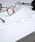 Two Piece White Pupil Distance Ruler For Eye Care And Prescription Eyeglasses PD Meter With Monocular And Binocular Measurement Options And Easy Read Scale Super Handy For Quick Accurate Fit, white ruler on desk