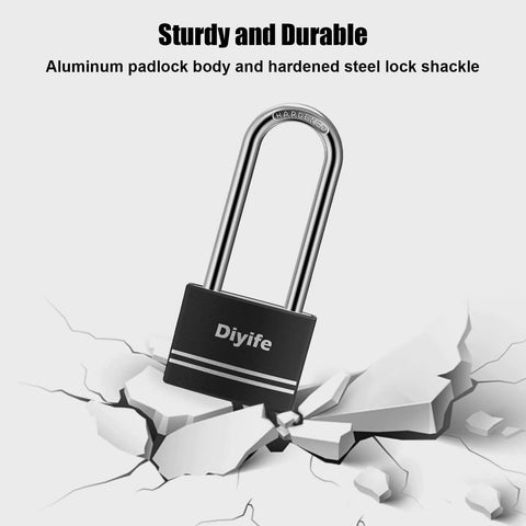 Aluminum Padlock With Key 2 Pack Waterproof And Rustproof Long Shackle Locks For Outdoor Use on cracked surface demonstrating durability.
