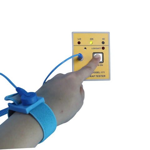 Portable Anti Static Wrist Strap Tester ESD Meter With Audible And Visual Pass Fail Indicator in use with attached wrist strap.